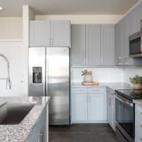 Apartment kitchen with granite countertops at Bellrock Memorial in Houston, Texas