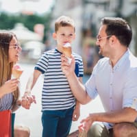 A happy family having ice-cream near Grand Villas Apartments in Katy, Texas