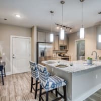 Seating at a kitchen island at The Lively Indigo Run in Ladson, South Carolina