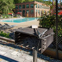 Bbq area for residents to grill at The Falls at 124 Water in Leominster, Massachusetts