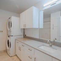 Spacious laundry room with lots of storage at City View in Lansing, Michigan
