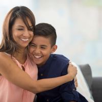 Resident hugging her son at Manchester Court in Modesto, California