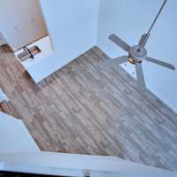 View looking down at living room from loft at  Ninety Degrees in Phoenix, Arizona