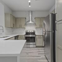 Kitchen with grey color cabinet at Trinity Bluff & Trinity District in Fort Worth, Texas 