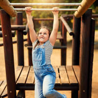 Resident child playing in park near Palisades Of Blythewood in Blythewood, South Carolina