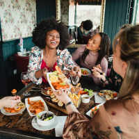 Resident friends out for a feast at their favorite restaurant near Howell Uptown in Dallas, Texas