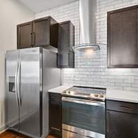 Kitchen with side by side refrigerator  at Domain Memorial in Houston, Texas  