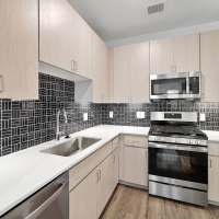 Kitchen with stainless-steel appliances at Lydian in Phoenix,Arizona