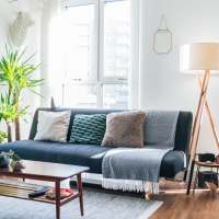 Large bay windows in a model home's living space at Art Lofts at Overton in Memphis, Tennessee