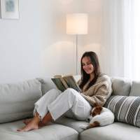 Resident with her pet dog by the side at Stonebridge Apartment Homes in Lufkin, Texas