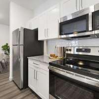 Kitchen with white cabinet at The Warrick in Nashville, Tennessee