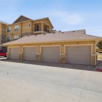 Charming stone-accented detached garages and landscaped grounds at Blue Ridge in Midland, Texas