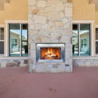 Inviting patio with a roaring fire at Blue Ridge in Midland, Texas