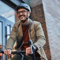 Resident cycling near WaterWalk Minneapolis - Plymouth in Plymouth, Minnesota