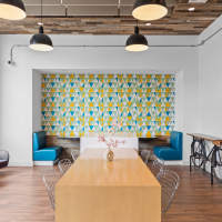 Modern furnishings in a model apartment's primary bedroom at Centric in Cleveland, Ohio