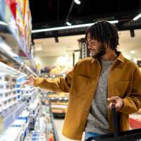 Grocery store aisle with man shopping at Tempo Fremont in Fremont, California