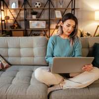 Resident using her laptop at Helios in Richmond, Virginia