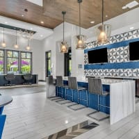 Clubhouse, community entertainment, and resident lounge area at 81 West Apartments in Fort Myers, Florida