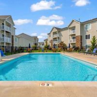 Relax by the sparkling pool at The Haven at Grand Landing Apartments in Grand Haven, Michigan