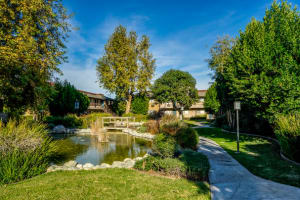 Pond and paved walkway outside at Casa Sierra in Riverside, California