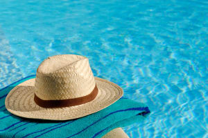 Elegant hat next to the large swimming pool at Mariposa at Westchester in Grand Prairie, Texas