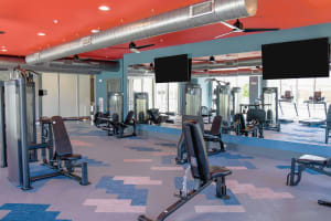 Fitness center with machines at The Waters at Heritage in Gonzales, Louisiana