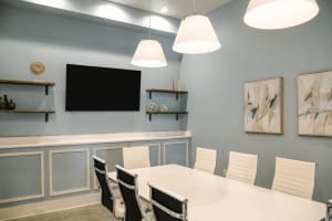 Community meeting room with TV at The Waters at Ransley in Pensacola, Florida
