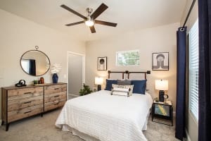 Cozy bedroom with ceiling fan at High Rock in Sparks, Nevada