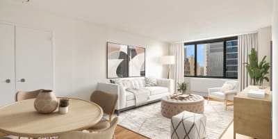 Huge windows in the living room that give you amazing views of the city at Carnegie Mews in New York, New York