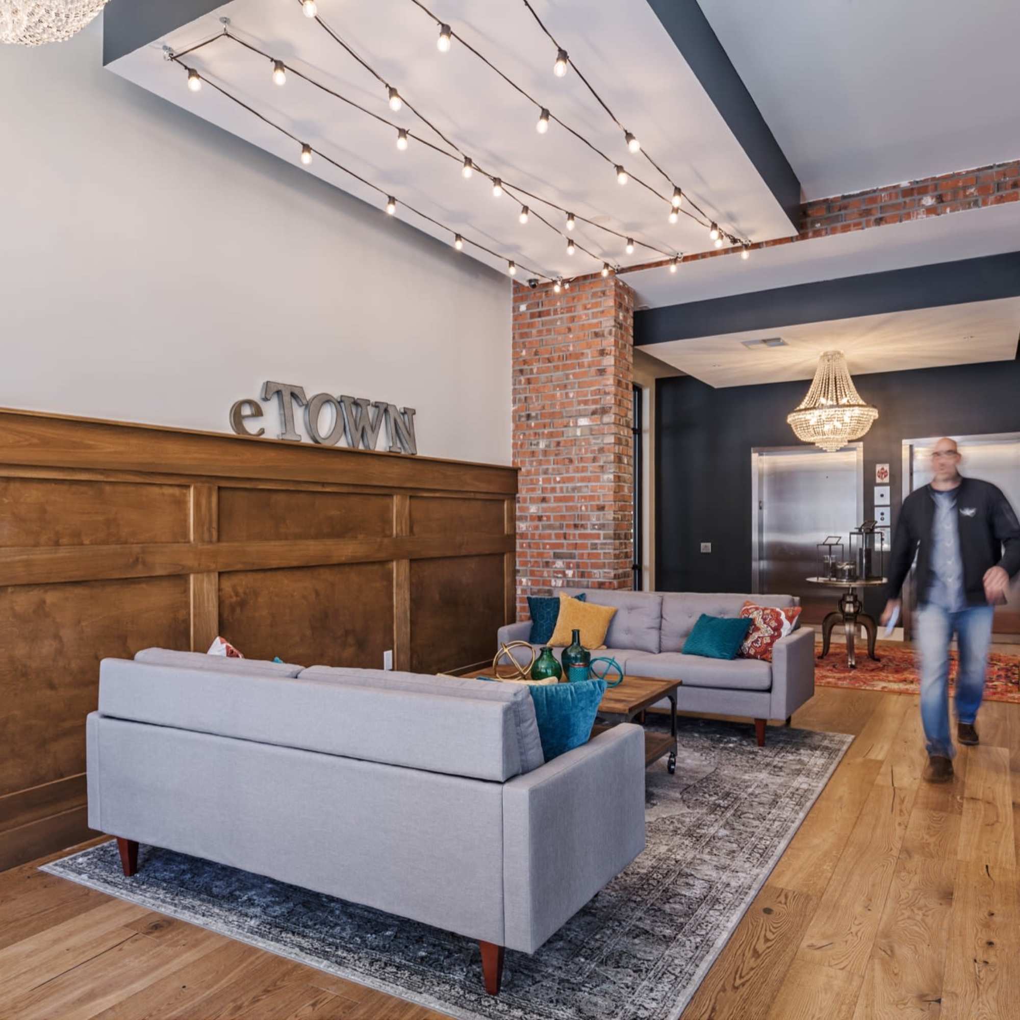 Exposed brick wall with decorative lighting at 223 E Town in Columbus, Ohio