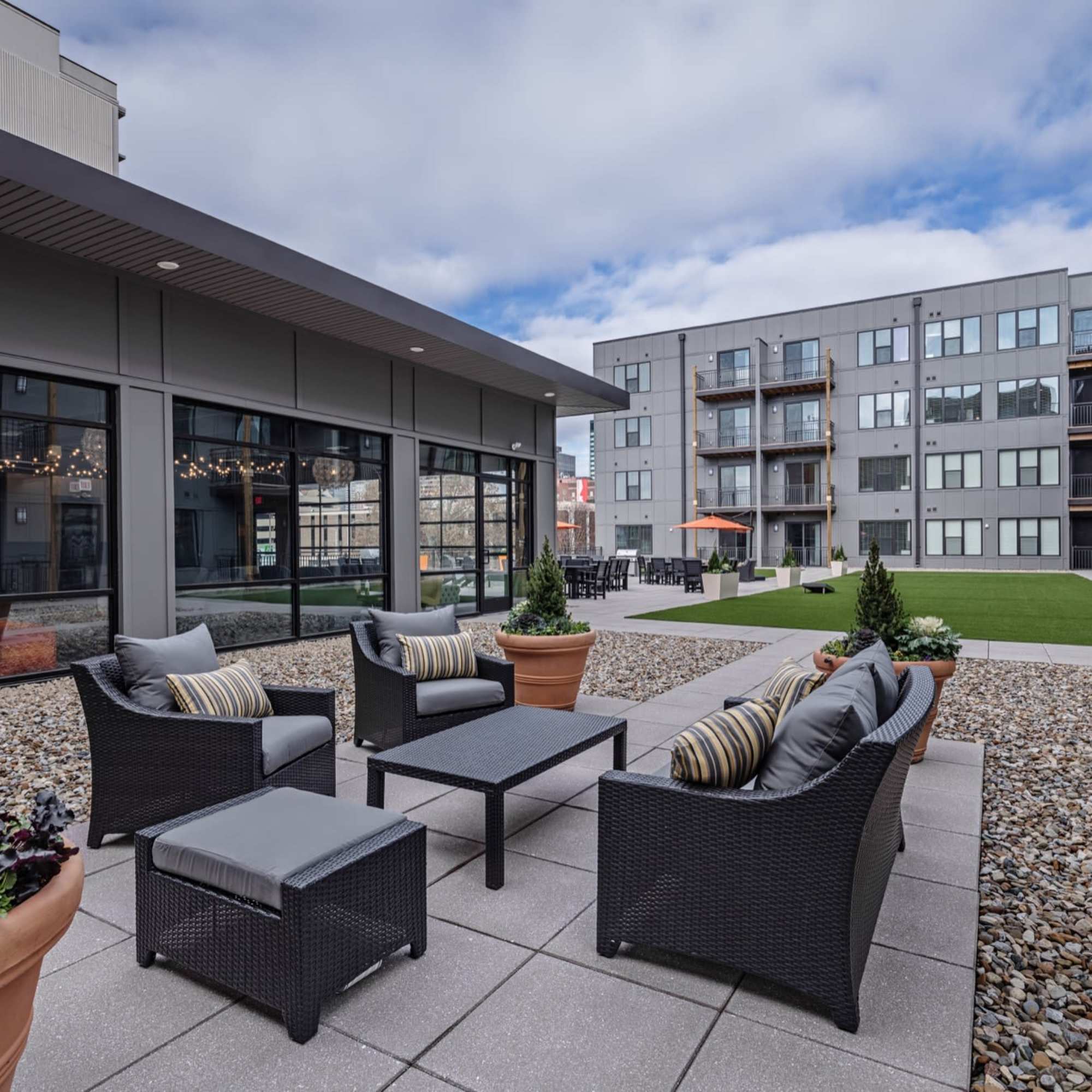 Seating area with gray chairs and table at 223 E Town in Columbus, Ohio