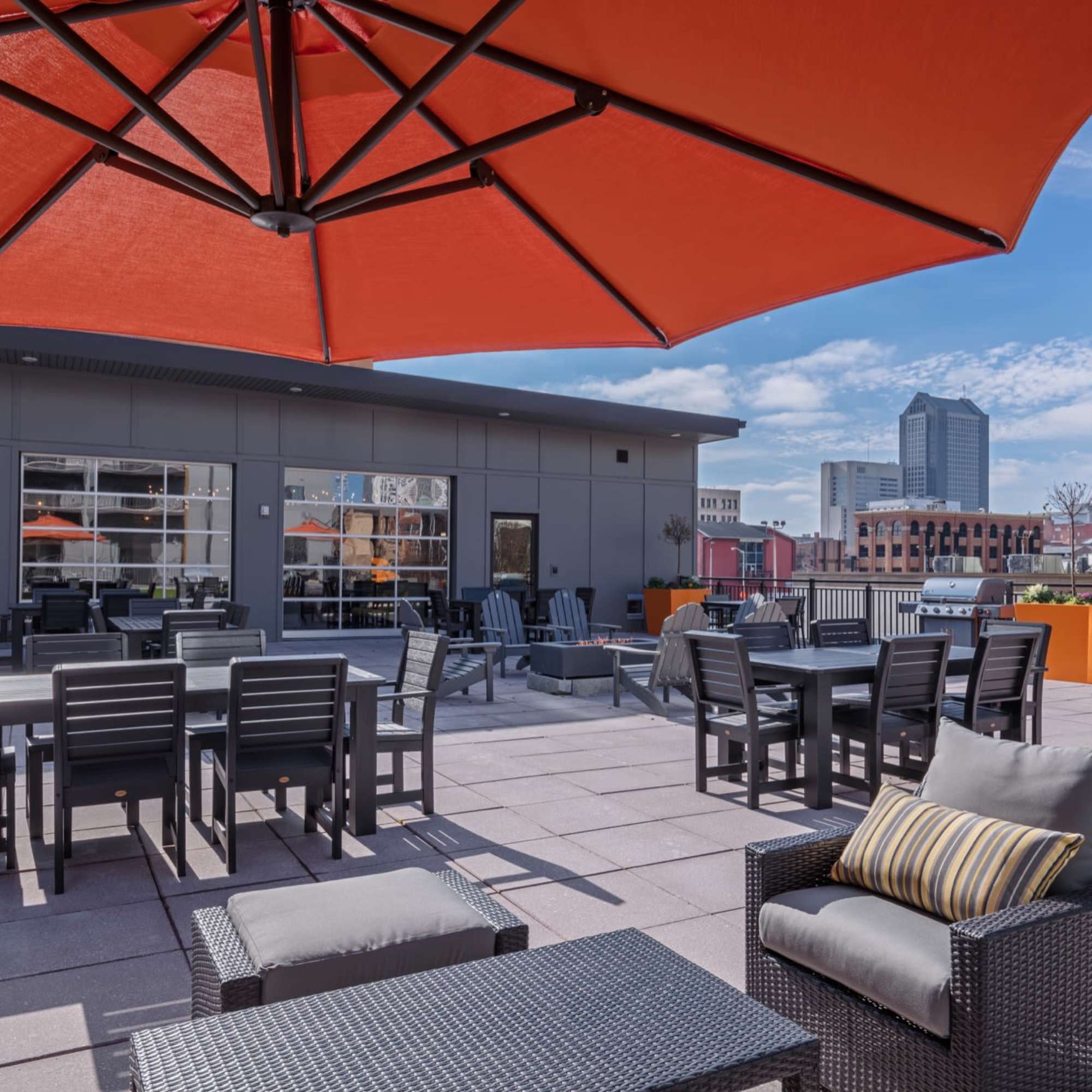 Orange umbrella shading outdoor seating area at 223 E Town in Columbus, Ohio