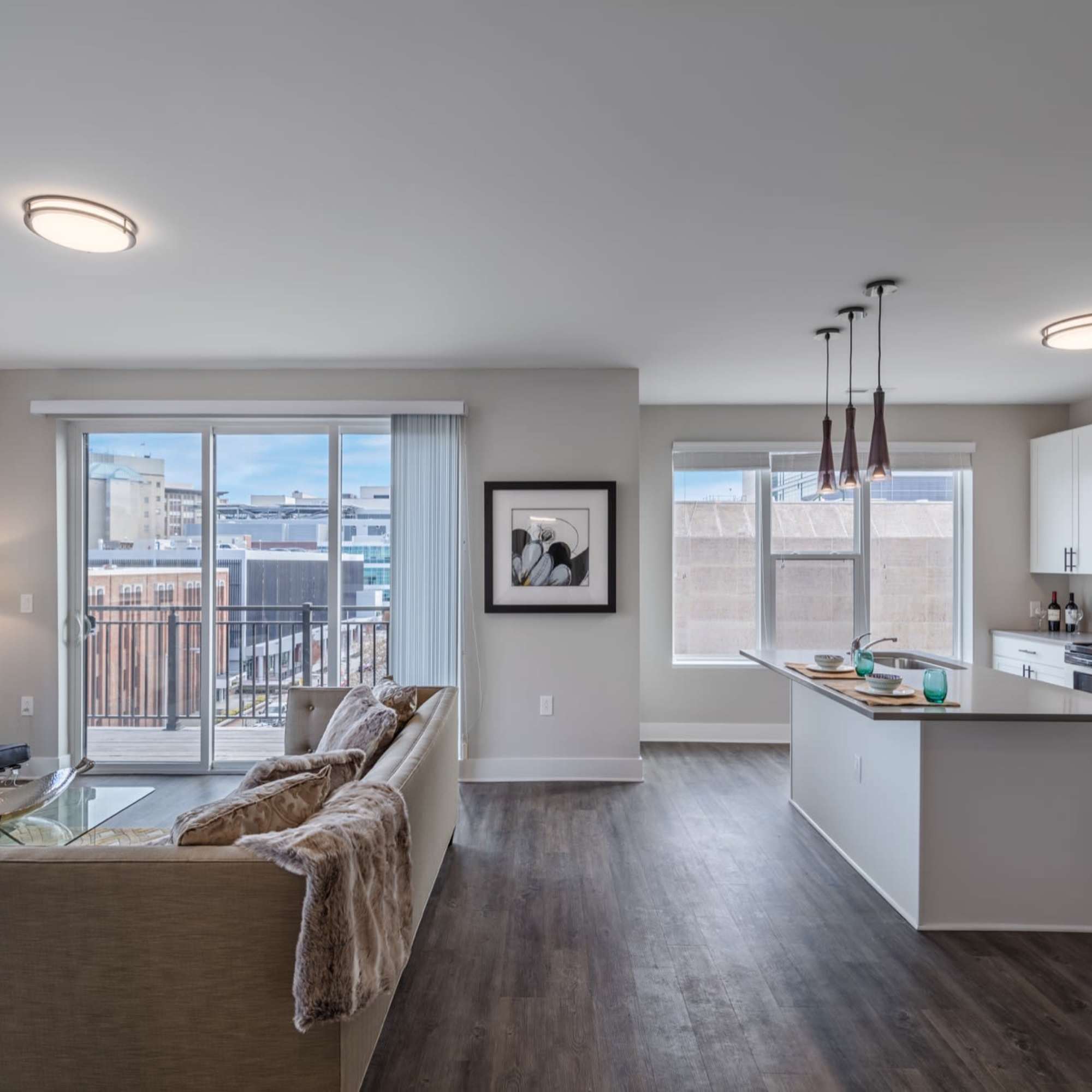 Living room with large windows and sofa at 223 E Town in Columbus, Ohio