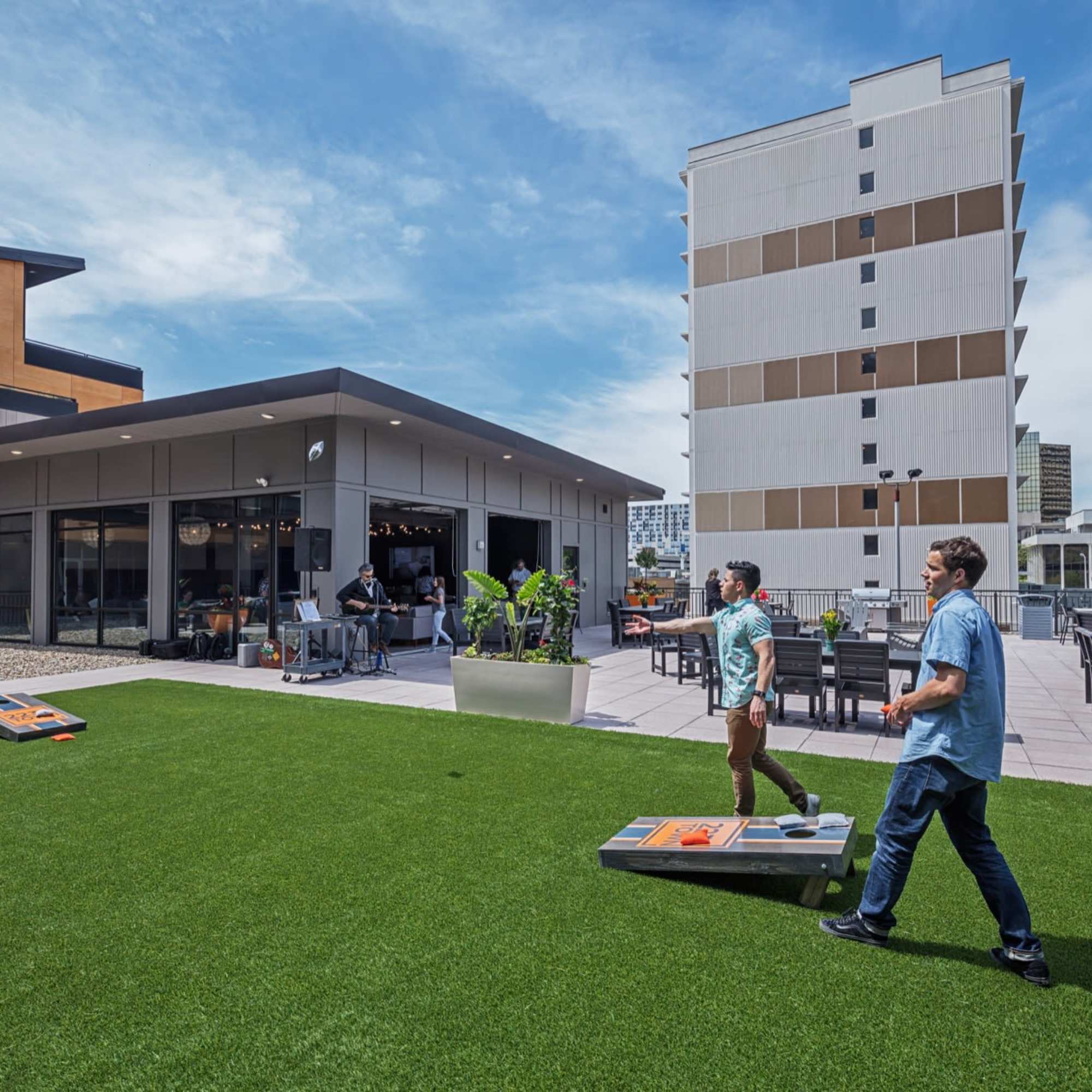 Cornhole boards on green grass at 223 E Town in Columbus, Ohio
