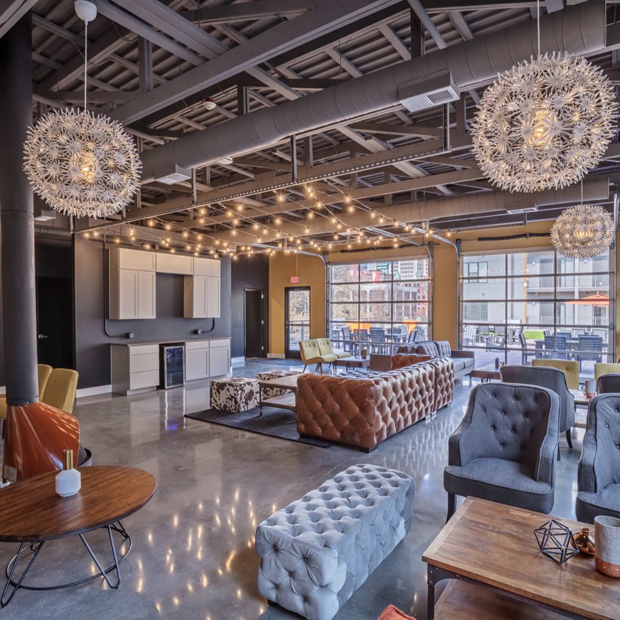 Chairs and couches with decorative lighting at 223 E Town in Columbus, Ohio