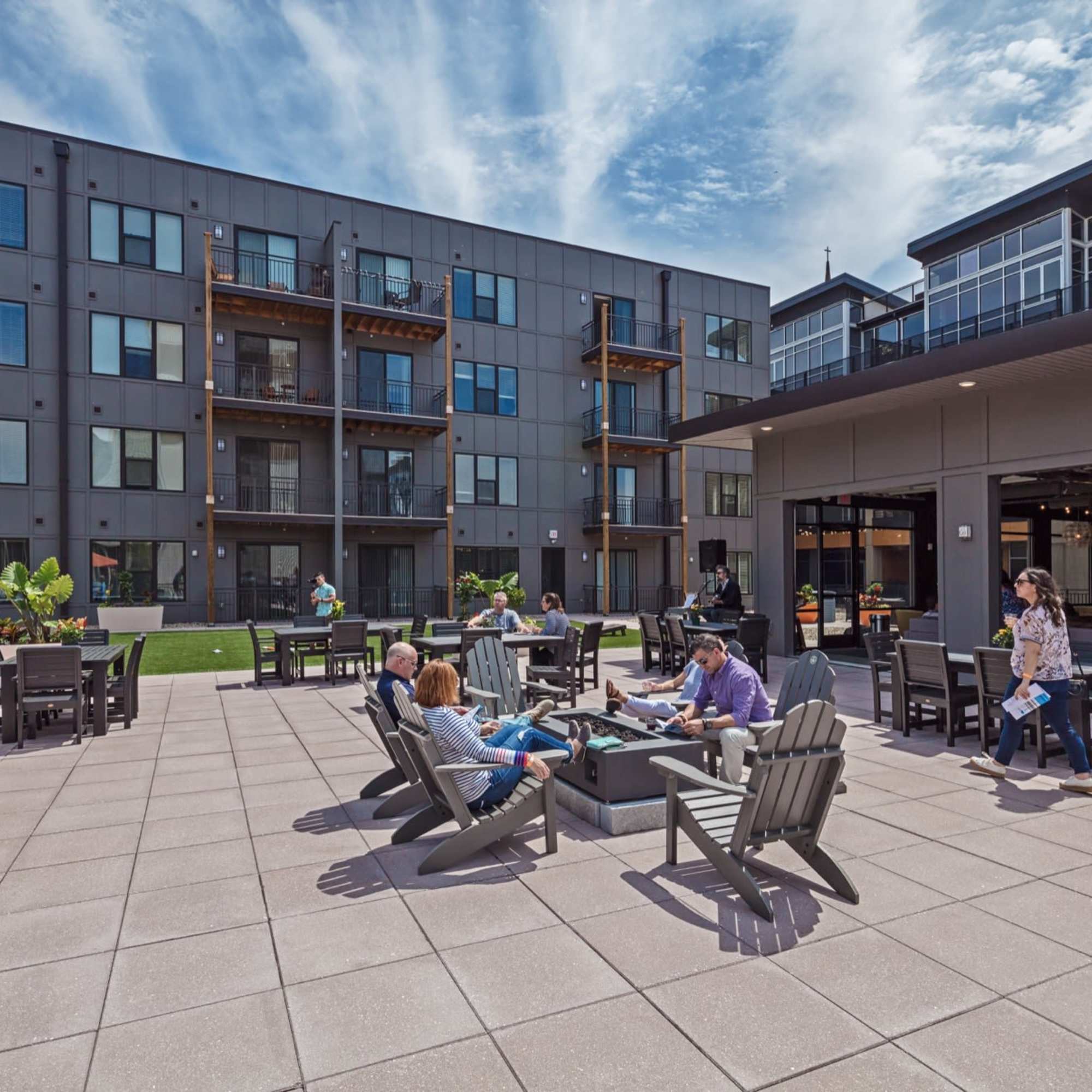 People sitting and enjoying around a fire pit at 223 E Town in Columbus, Ohio