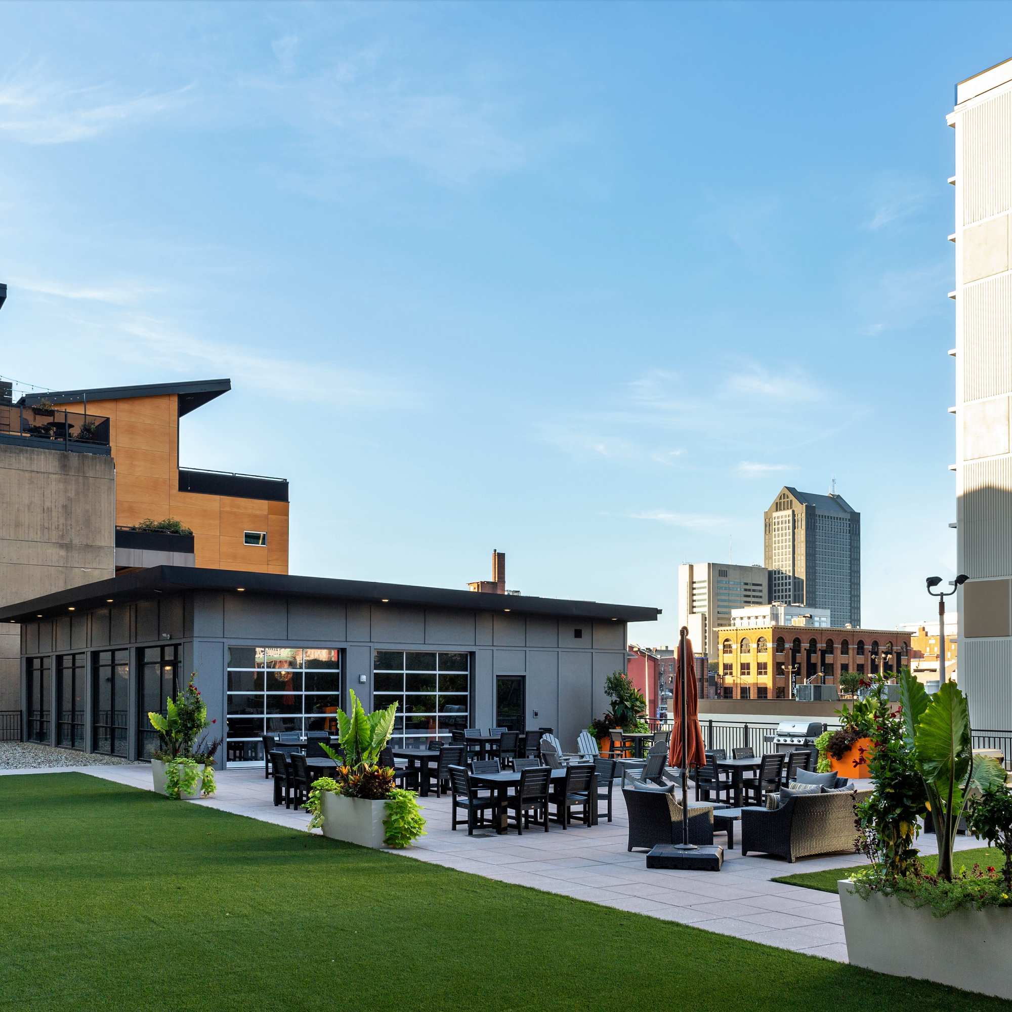 Rooftop patio with seating and greenery at 223 E Town in Columbus, Ohio