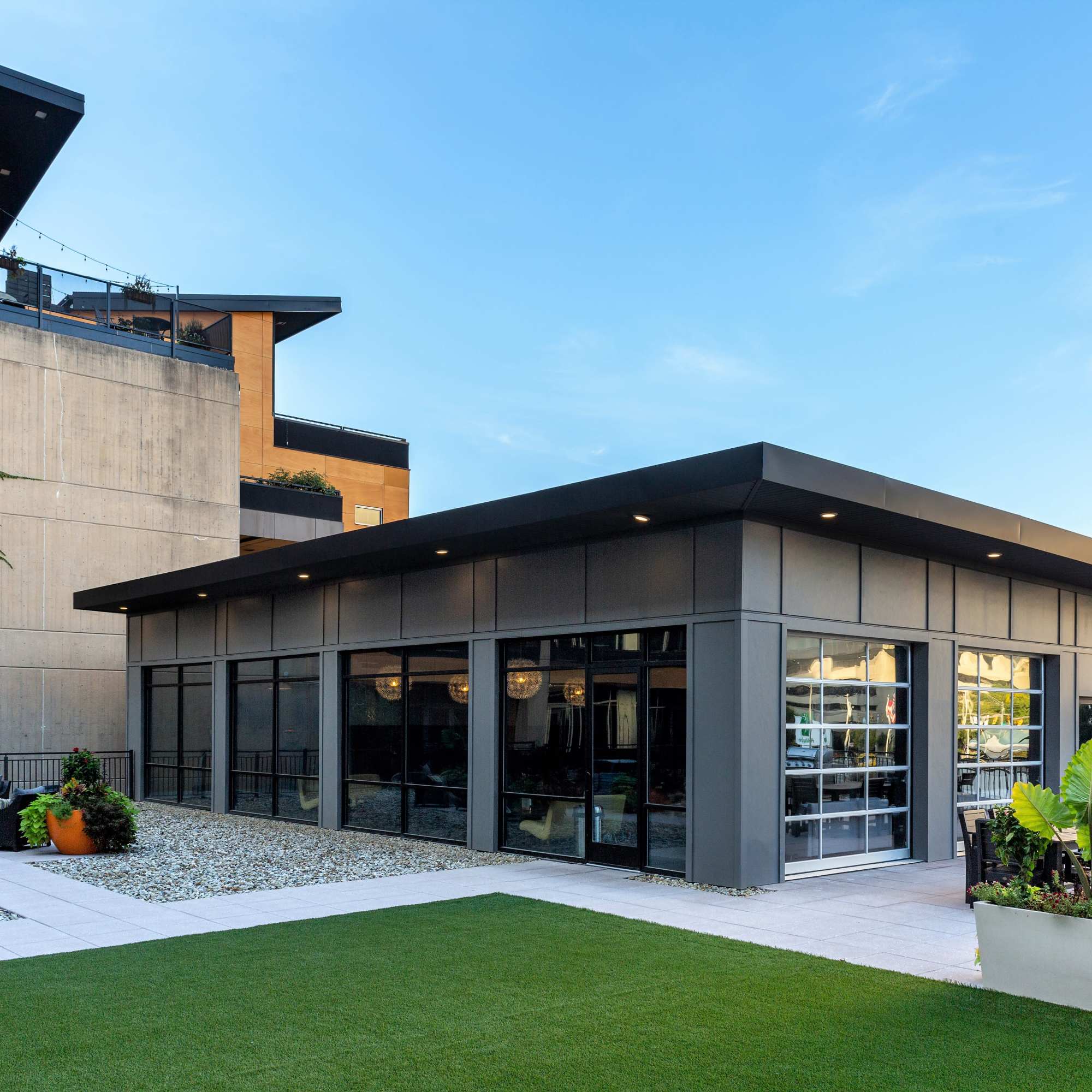 Concrete wall with windows and greenery at 223 E Town in Columbus, Ohio