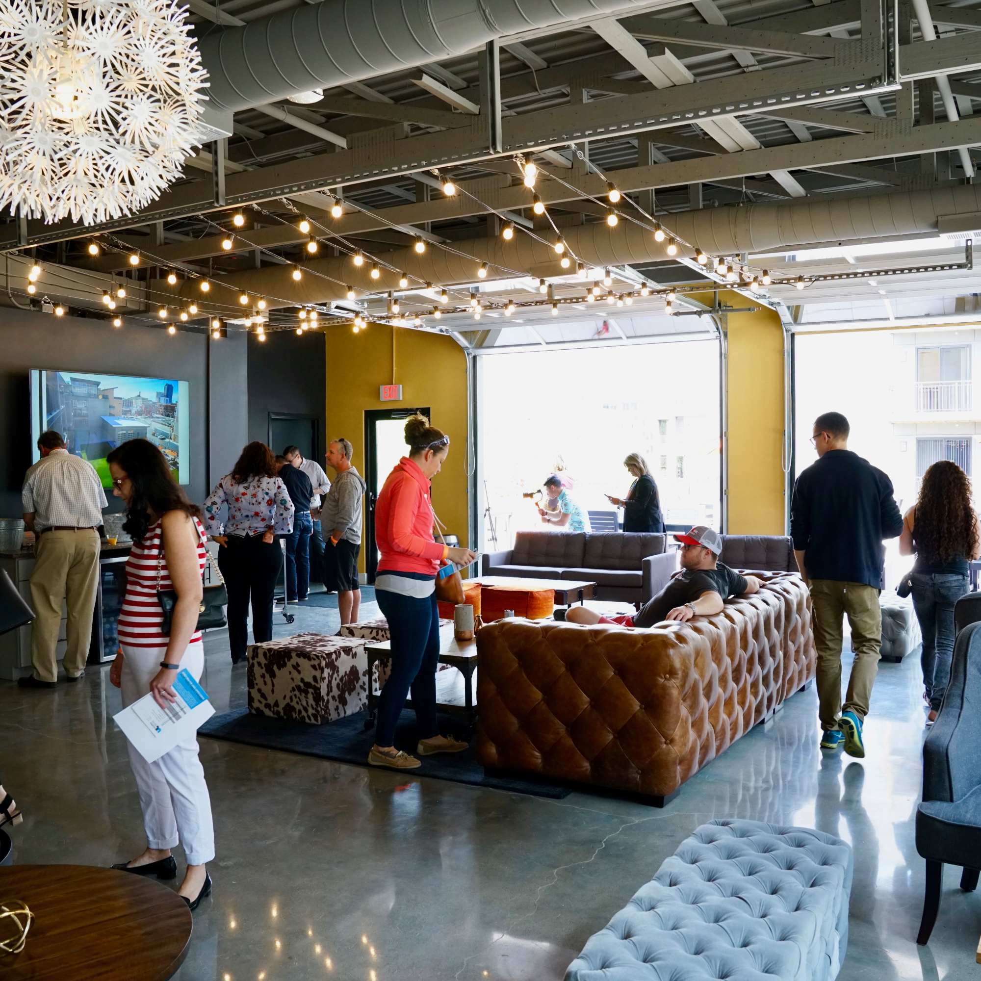 Large open garage door with people outside at 223 E Town in Columbus, Ohio