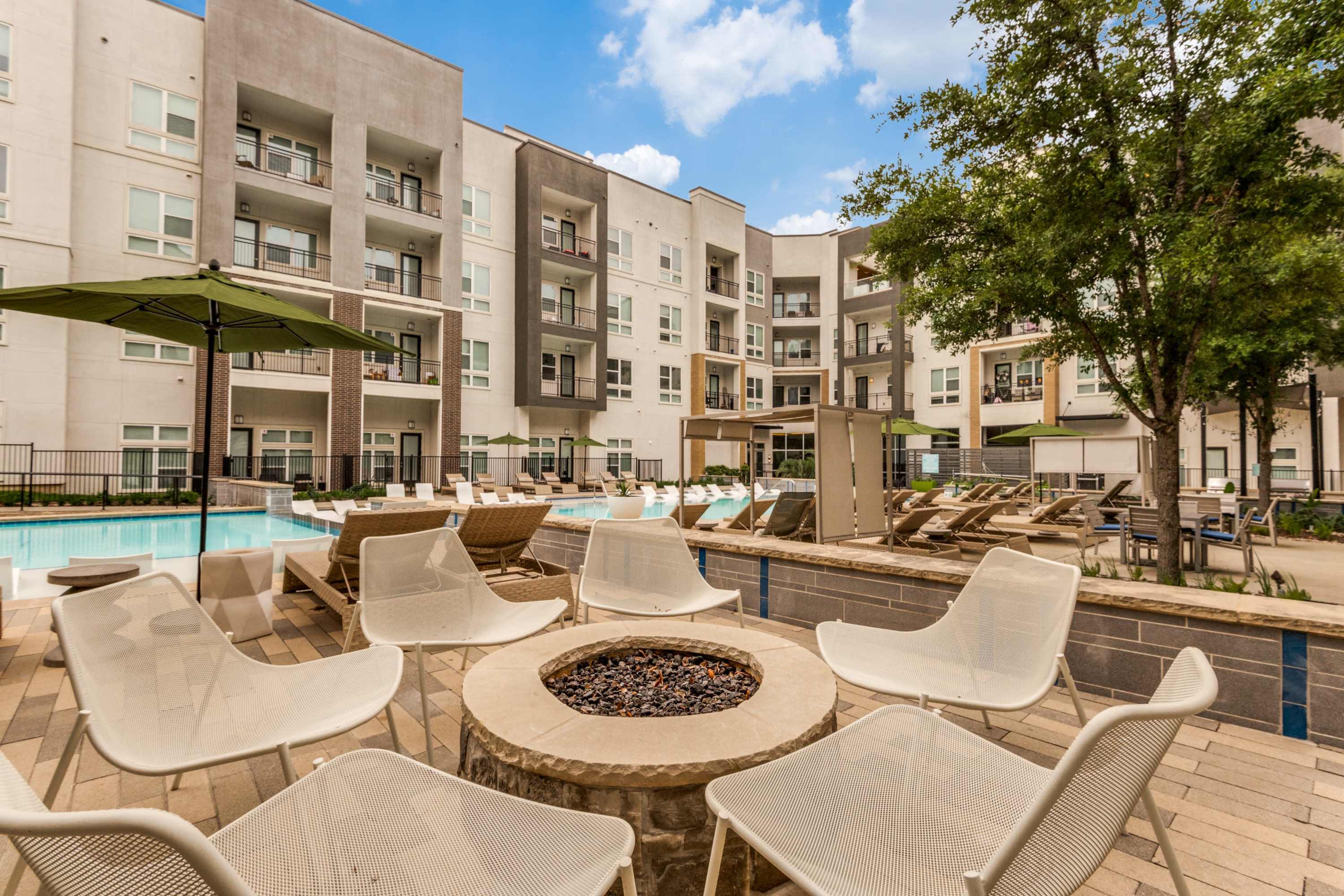 Bonfire by the poolside at 801 LasCo in Irving, Texas