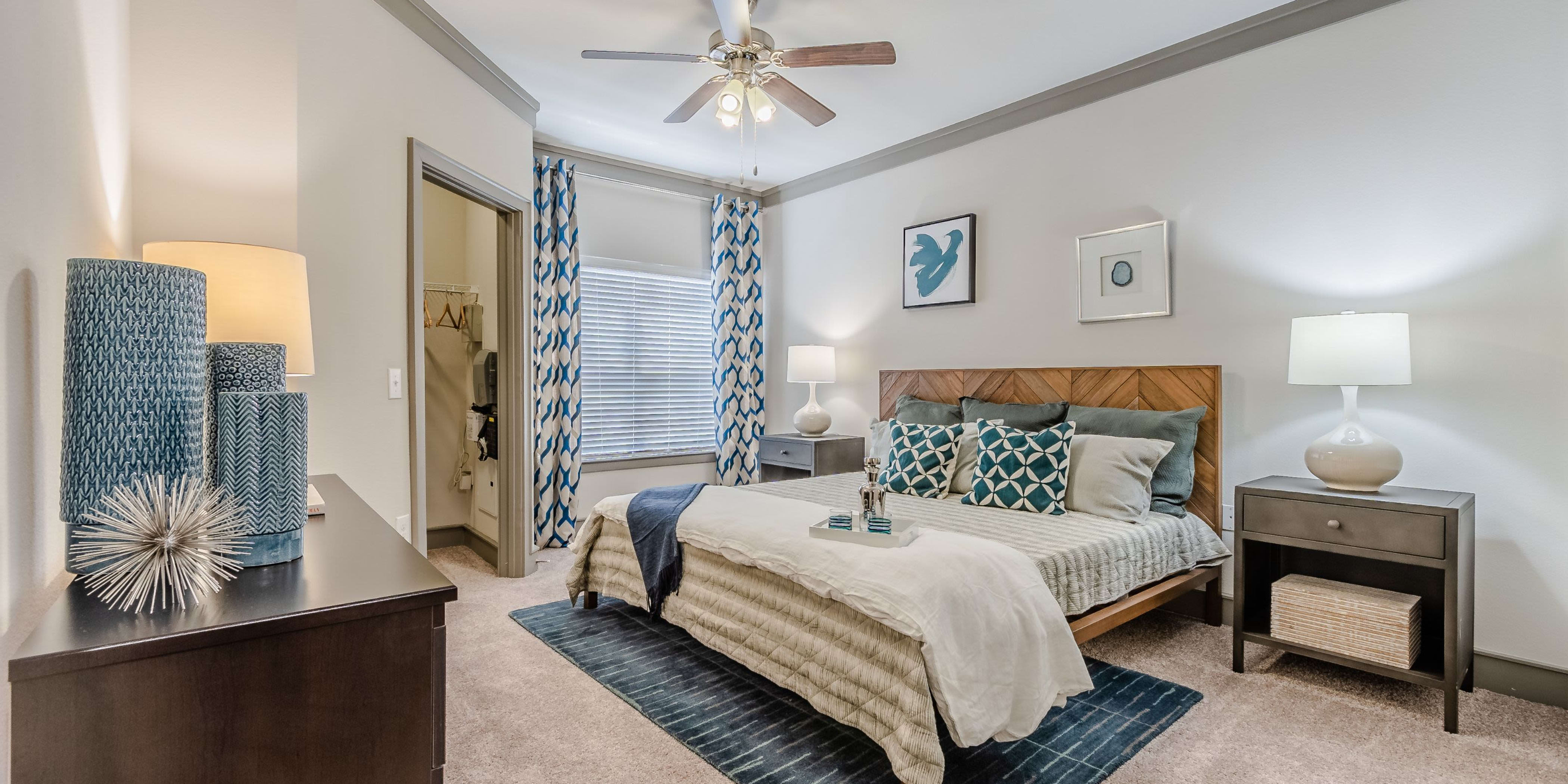 Master bedroom with a ceiling fan at Sorrel Phillips Creek Ranch in Frisco, Texas