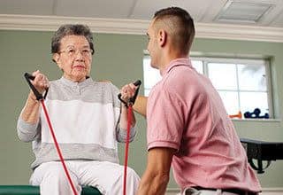 Senior living resident in Oakleaf Senior Living doing exercise