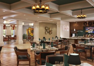View of beautiful floral arrangement on table of lobby in Merrill Gardens at ChampionsGate