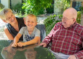 Grandparents with their grandson at Royal Palm Senior Living in Port Charlotte, Florida