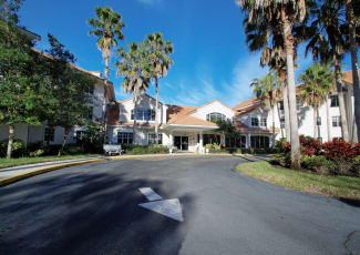 The front of the building at Sunset Lake Village Senior Living in Venice, FL