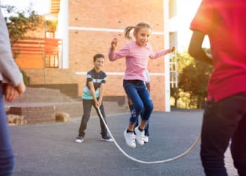 Kids jumping rope at Brookwood Apartments in Indianapolis, Indiana