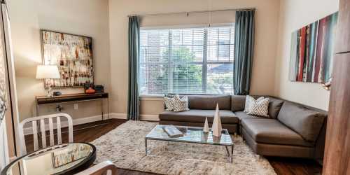 Spacious living room with large windows at West End Village in Nashville, Tennessee