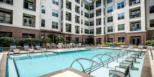 Swimming pool with lounge beds at West End Village in Nashville, Tennessee