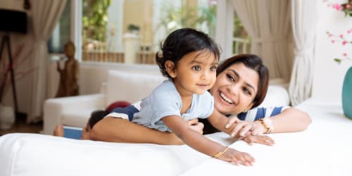 Happy mother with her baby at Curtis Johnson in Los Angeles, California
