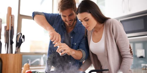 Happy couple cooking at  Curtis Johnson in Los Angeles, California